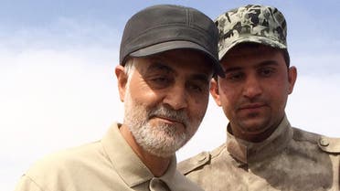 Iranian Revolutionary Guard Commander Qassem Soleimani (L) stands at the frontline during offensive operations against Islamic State militants in the town of Tal Ksaiba in Salahuddin province March 8, 2015. (Reuters)