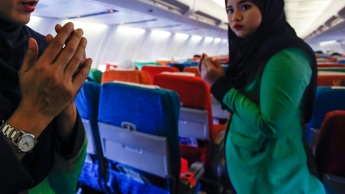 Happier days In this Dec. 22, 2015, photo, a Rayani Air flight crew walks down the aisle on board before departure at Kuala Lumpur International Airport 2 in Sepang, Malaysia. (AP)
