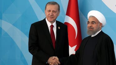 Turkey's President Recep Tayyip Erdogan, left, greets Iran's President Hassan Rouhani shake hands before the leaders and representatives of the Islamic countries gather for the 13th Organization of Islamic Cooperation, OIC, Summit in Istanbul, Thursday, April 14, 2016. (Anadolu Agency, Pool via AP)