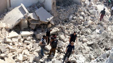 Residents look for survivors amidst the rubble after an airstrike on the rebel-held Old Aleppo, Syria April 16, 2016. REUTERS