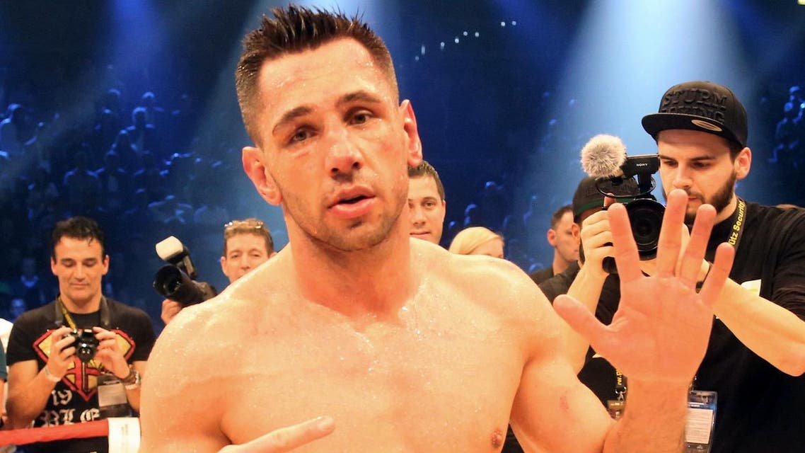 In this photo taken Saturday, Feb. 20, 2016, Felix Sturm of Germany reacts after winning against Fedor Chudinov of Russia in their WBA super middleweight boxing fight in Oberhausen, Germany. Sturm defeated the previously unbeaten Chudinov by majority decision in their rematch to reclaim his WBA super middleweight title. (Roland Weihrauch/dpa via AP)