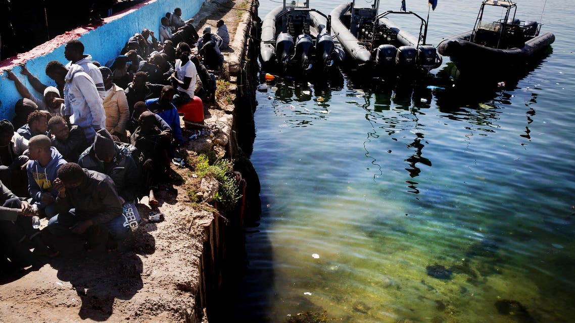 African illegal migrants wait to receive medial assistance after being rescued by coastal guards on a port in Tripoli, Libya, Monday, April 11, 2016. AP