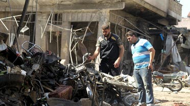 Men inspect damaged motorcycles after an airstrike on a market on a town in the insurgent stronghold of Idlib province, Syria April 19, 2016. (Reuters)