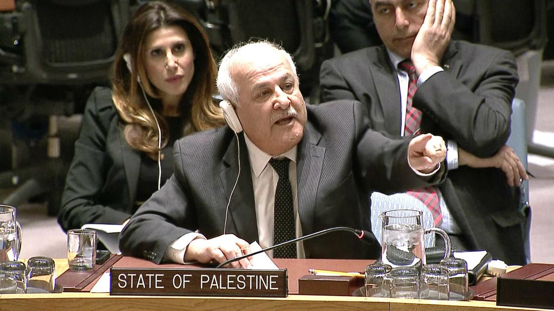 In this image made from a video provided by UNTV, Palestinian envoy Riyad Mansour, center, speaks to Israel's Ambassador Danny Danon, not pictured, at an United Nations Security Council meeting Monday, April 18, 2016, at United Nations headquarters. (UNTV via AP)