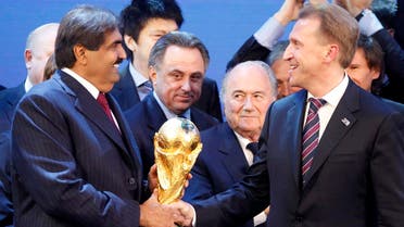 FIFA President Joseph Blatter, 2nd right, is flanked by Russian Deputy Prime Minister Igor Shuvalov, right, and Sheikh Hamad bin Khalifa Al-Thani, Emir of Qatar, left, after the announcement that Russia will be the host country for the soccer World Cup 2018 and Qatar the host for the tournament in 2022 in Zurich, Switzerland, Thursday, Dec.2, 2010. Left is Russian national team player Andrei Arshavin. (AP)