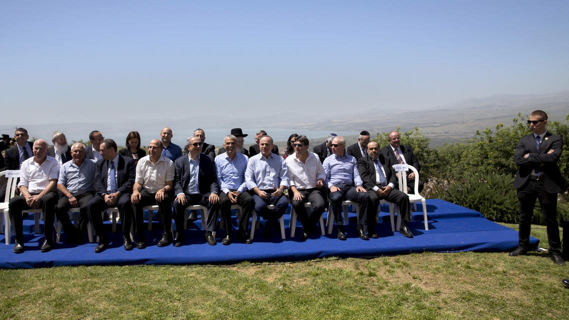 Israeli Prime Minister Benjamin Netanyahu (5th L, front row) poses with ministers prior to the weekly cabinet meeting in the Israeli occupied Golan Heights near the ceasefire line between Israel and Syria, April 17, 2016