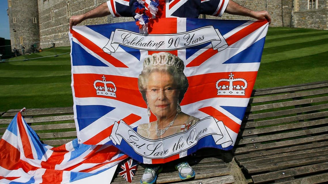 John Loughrey, a royal fan displays a flag in Windsor, England, Wednesday, April 20, 2016. Royal fans are gathering in Windsor ahead of Thursday's celebrations for the 90th birthday of Britain's Queen Elizabeth II. (AP)
