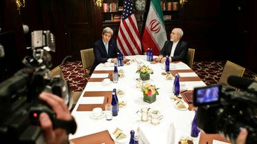 U.S. Secretary of State John Kerry, left, speaks to the media as he meets with Iranian Foreign Minister Mohammad Javad Zarif, right, Friday, April 22, 2016, in New York. (AP Photo/Frank Franklin II)