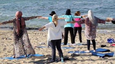 Breathing easy: women escape the realities of conflict-torn Libya at a seaside yoga. (AFP)
