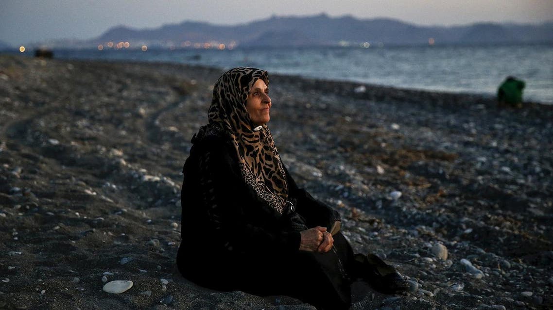 Amoun, 70, a blind Palestinian refugee who lived in the town of Aleppo in Syria, rests on a beach moments after arriving along with another forty on a dinghy in the Greek island of Kos, crossing a part of the Aegean Sea from Turkey to Greece, August 12, 2015. Reuters and The New York Times shared the Pulitzer Prize for breaking news photography for images of the migrant crisis in Europe and the Middle East. (Reuters)
