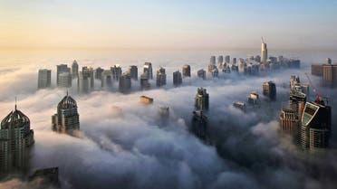 In this Monday, Oct. 5, 2015 photo, a thick blanket of early morning fog partially shrouds the skyscrapers of the Marina and Jumeirah Lake Towers districts of Dubai, United Arab Emirates. (AP)