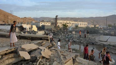 People inspect damage at a site hit by Saudi-led air strikes in the al Qaeda-held port of Mukalla city in southern Yemen. (Reuters)