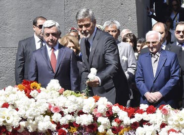 Armenia's President Sargsyan, actor Clooney and singer Aznavour attend a flower-laying ceremony at the Tsitsernakaberd Armenian Genocide Memorial Museum in Yerevan. (Reuters)