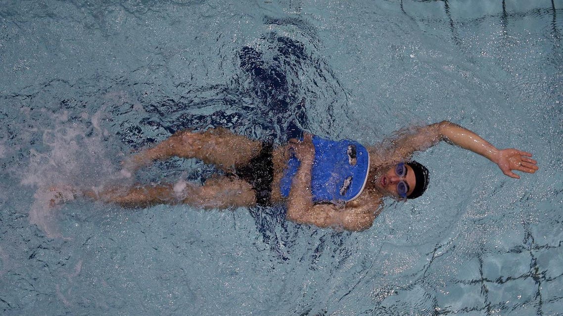 Syrian Ibrahim Al-Hussein practices during his training session at the Olympic Indoor swimming pool in Athens, Monday, April 25, 2016. TAs a swimming-mad teenager in Syria, Ibrahim Al-Hussein was glued to his TV set for the 2004 Athens Olympics. Twelve years later in Athens, disabled but still doggedly swimming, he will represent the tens of thousands of displaced people in Greece by carrying the Olympic flame in the Rio torch relay’s Greek leg. (AP)