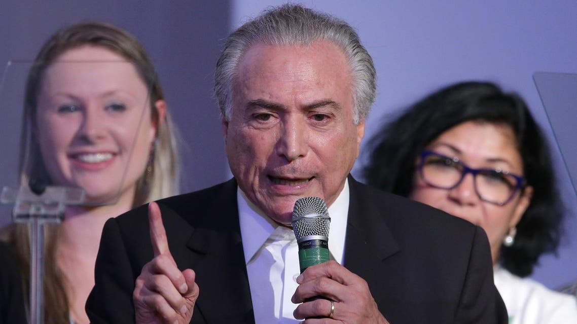 Brazil’s Vice President Michel Temer, speaks at the Brazilian Democratic Movement Party, (PMDB), national convention in Brasilia, Brazil, Saturday, March 12, 2016. The PMDB is considering abandoning its alliance with the Workers' Party that began during the government of Dilma Rousseff's predecessor, Luiz Inacio Lula da Silva. (AP)
