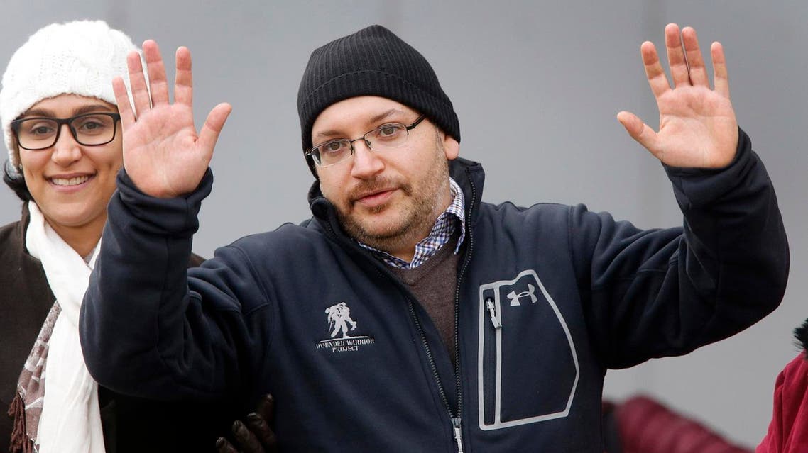 U.S. journalist Jason Rezaian gestures next to his wife Yeganeh Salehi as he poses for media people in front of Landstuhl Regional Medical Center in Landstuhl, Germany, Wednesday, Jan. 20, 2016. Rezaian was released from an Iranian prison last Saturday. (AP)
