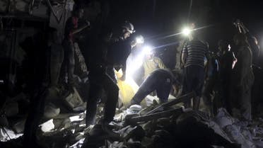Civil defence members search for survivors after an airstrike at a field hospital in the rebel held area of al-Sukari district of Aleppo. (Reuters)