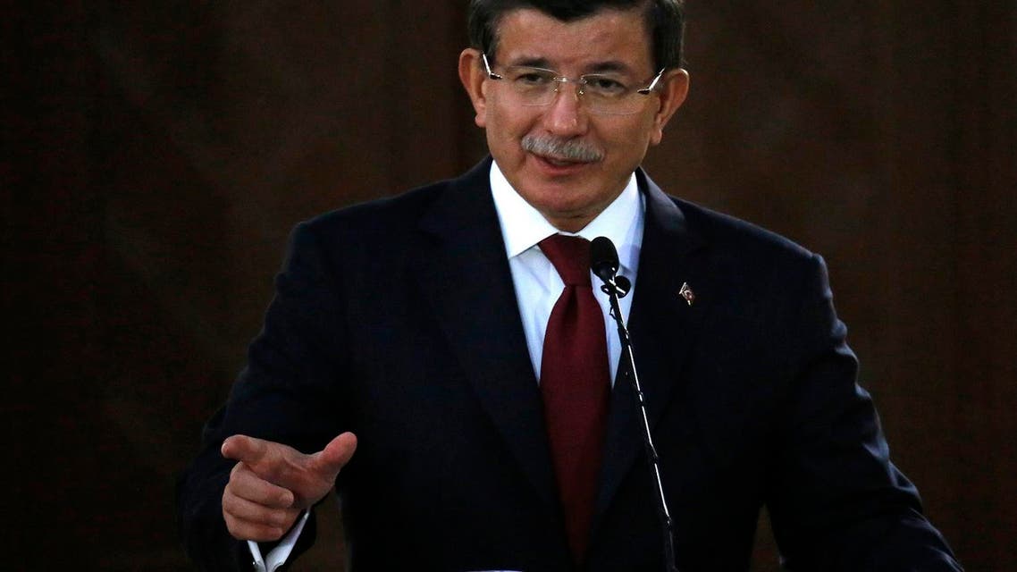 Turk?sh Prime Minister Ahmet Davutoglu speaks to the media during a press conference after a meeting with Turkish Cypriot leader Mustafa Akinci in the breakaway, Turkish Cypriot northern part of the divided capital Nicosia, Cyprus, Tuesday, Dec. 1, 2015. Davutoglou is in Turkish Cypriot breakaway northern part of the ethnically split island for one-day visit. (AP Photo/Petros Karadjias)