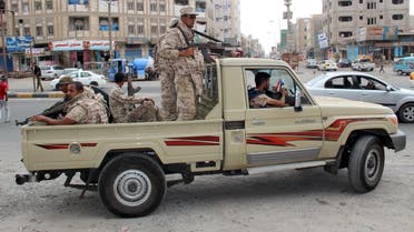 Yemeni army soldiers patrol a street in Mansoura district of Yemen's southern port city of Aden. (Reuters)