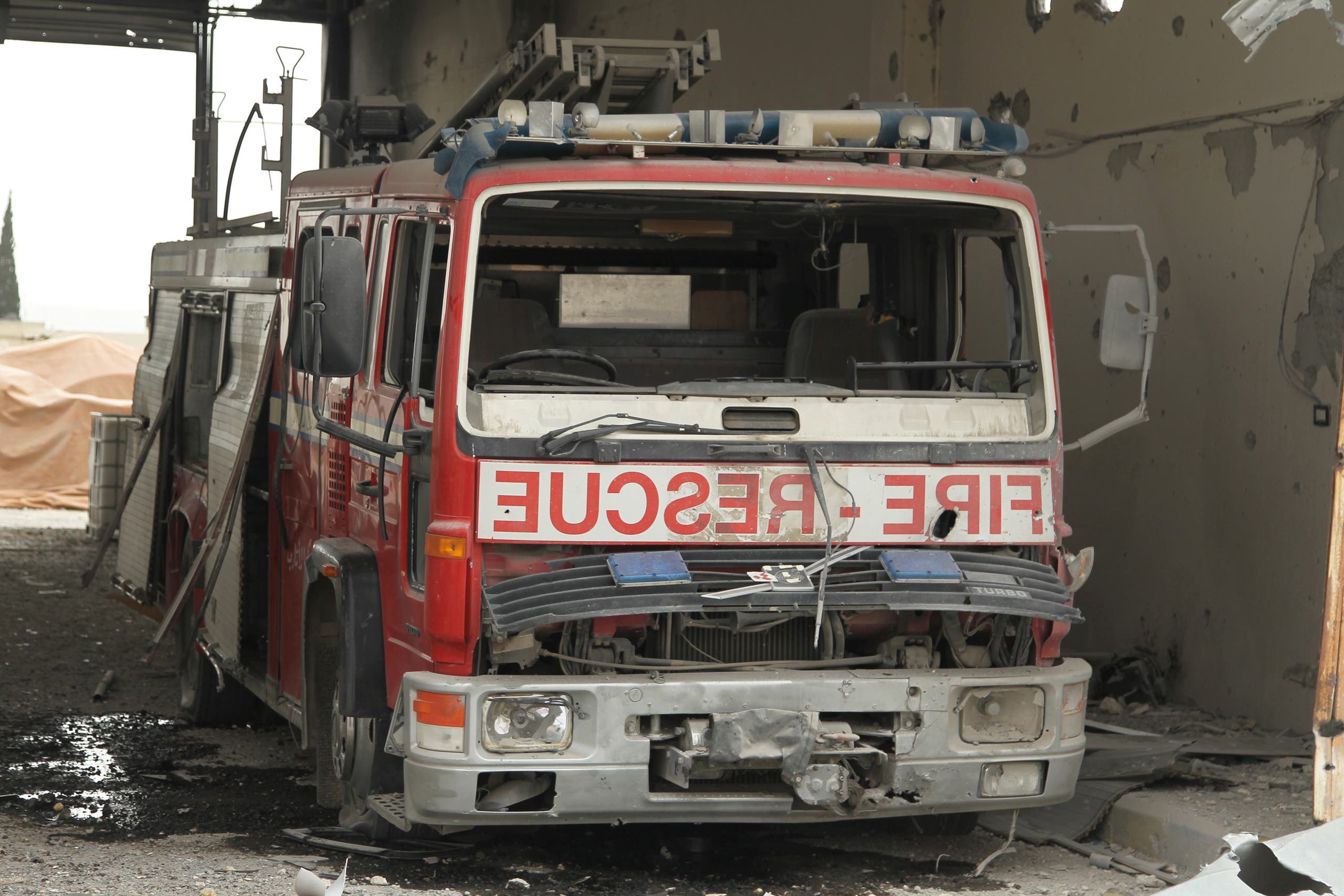 A damaged Civil Defence truck is pictured inside a rescue station in the rebel held town of Atareb, Aleppo countryside, Syria