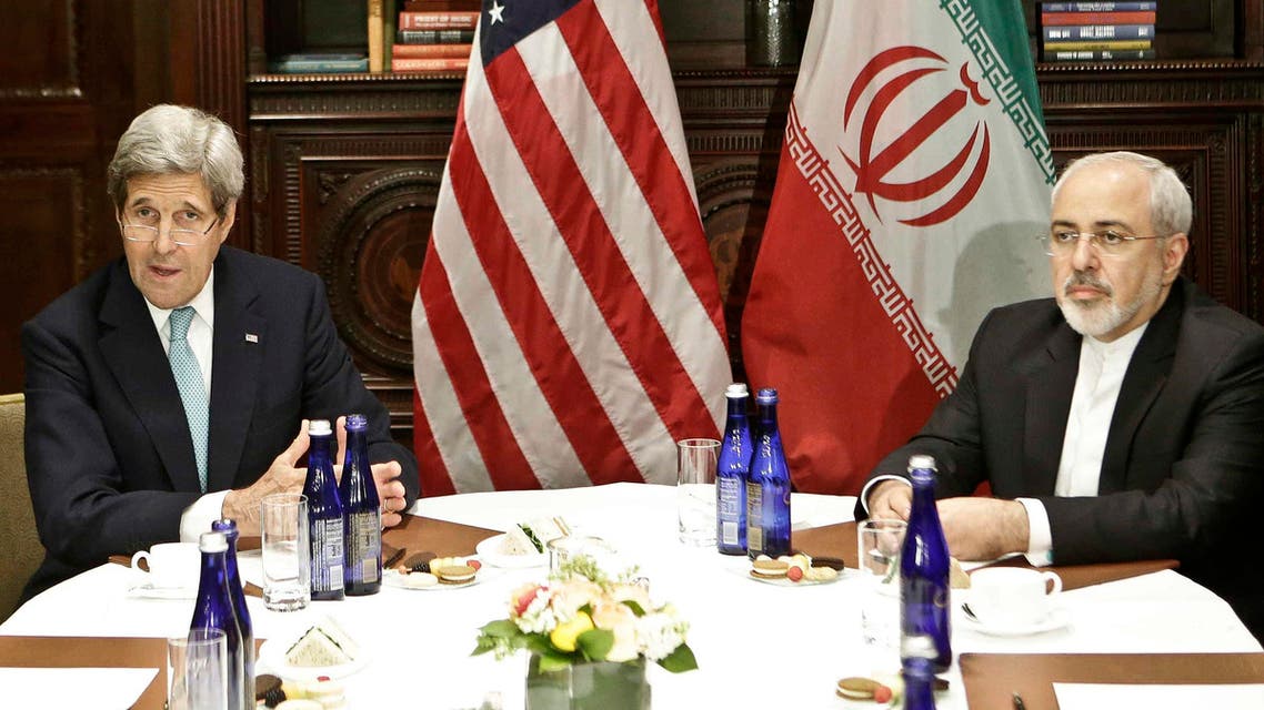 US Secretary of State John Kerry, left, speaks to the media as he meets with Iranian Foreign Minister Mohammad Javad Zarif Friday, April 22, 2016, in New York. (AP)