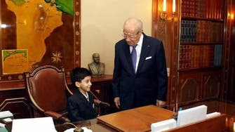 Seat of power: Tunisian president allows sick boy to sit on his chair