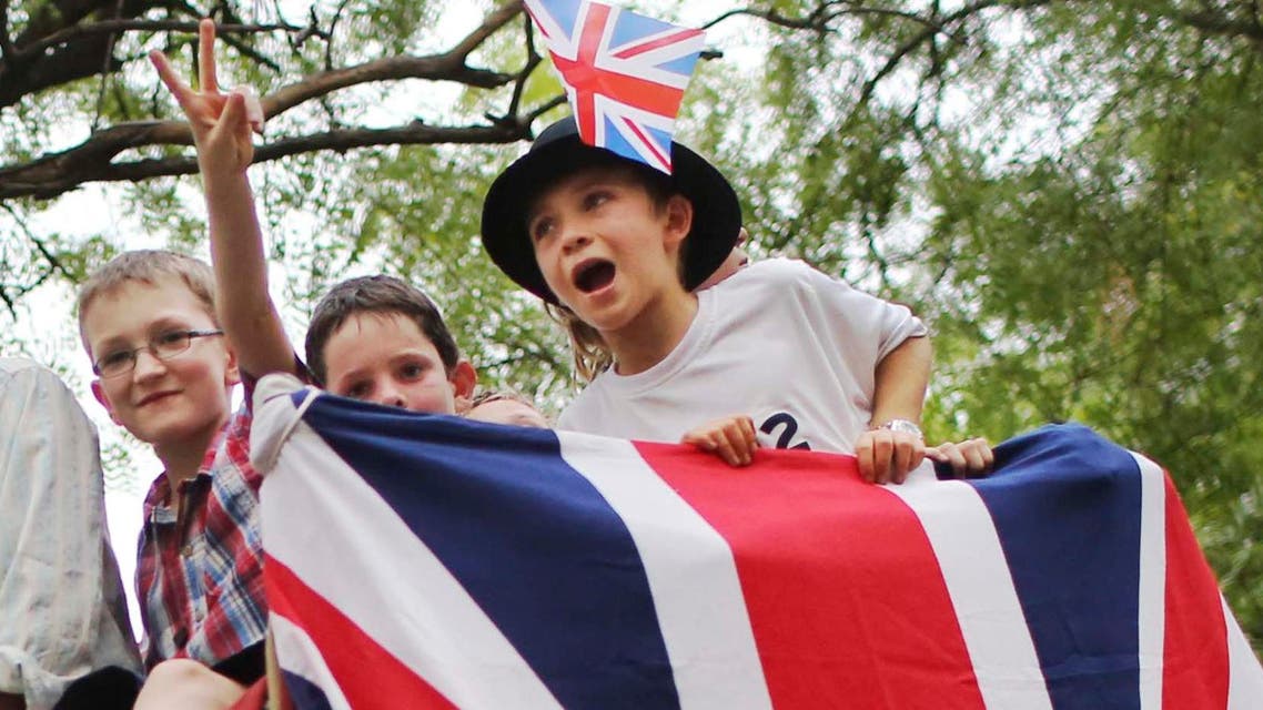 British expatriate children ride an elephant during a party to commemorate Queen Elizabeth's Diamond Jubilee celebration in 2012. (AP)