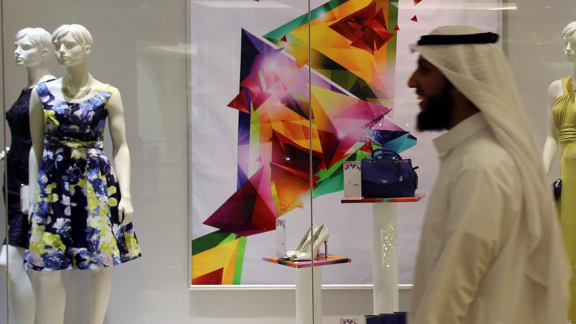 An Arab man passes by a fashion store decorated for the holy month of Ramadan in Dubai, United Arab Emirates. (File photo: AP)