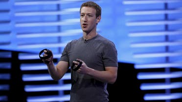 Facebook CEO Mark Zuckerberg holds a pair of the touch controllers for the Oculus Rift virtual reality headsets on stage during the Facebook F8 conference in San Francisco, California April 12, 2016. REUTERS