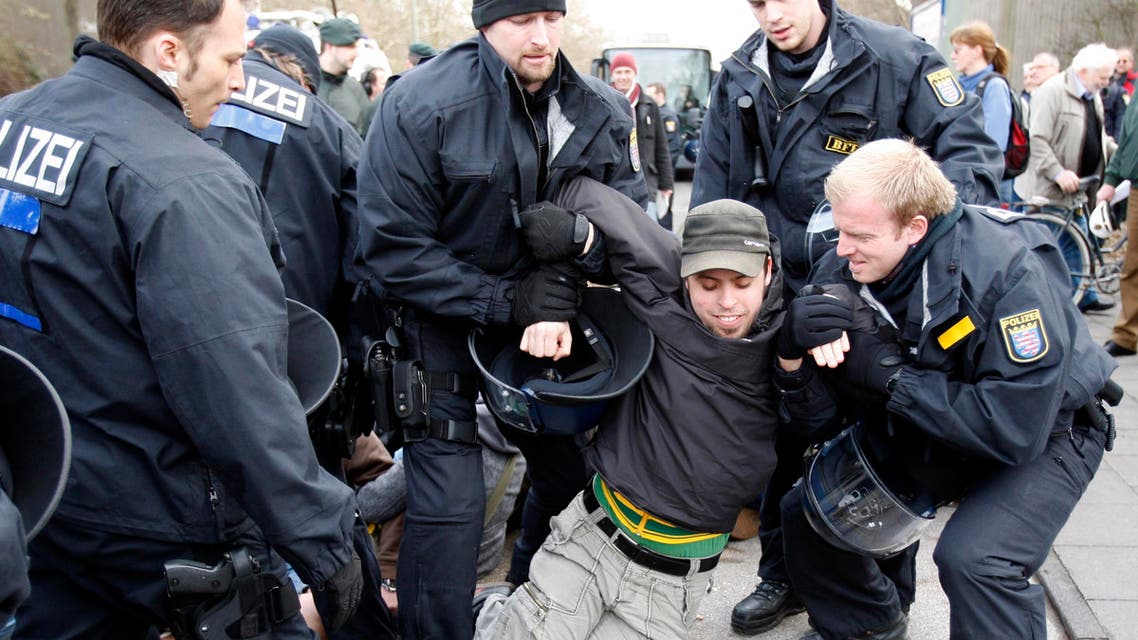 A left wing protestor is arrested by special police forces during a demonstration AP