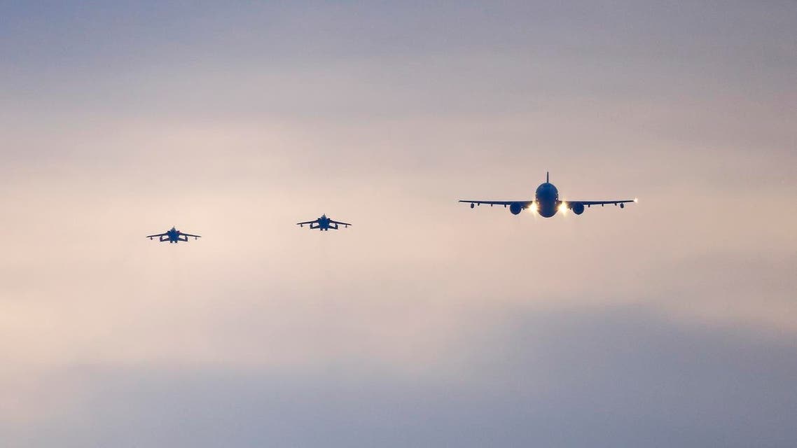 German air force Tornado jets and a cargo aircraft approach to land at an airbase in Incirlik, Turkey, December 10, 2015. The first the German air force Tornado reconnaissance jets will take off for Turkey's Incirlik air base on Thursday, to support the military campaign against Islamic State. REUTERS
