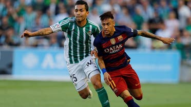 Barcelona's Neymar and Real Betis' Petros Araujo in action.