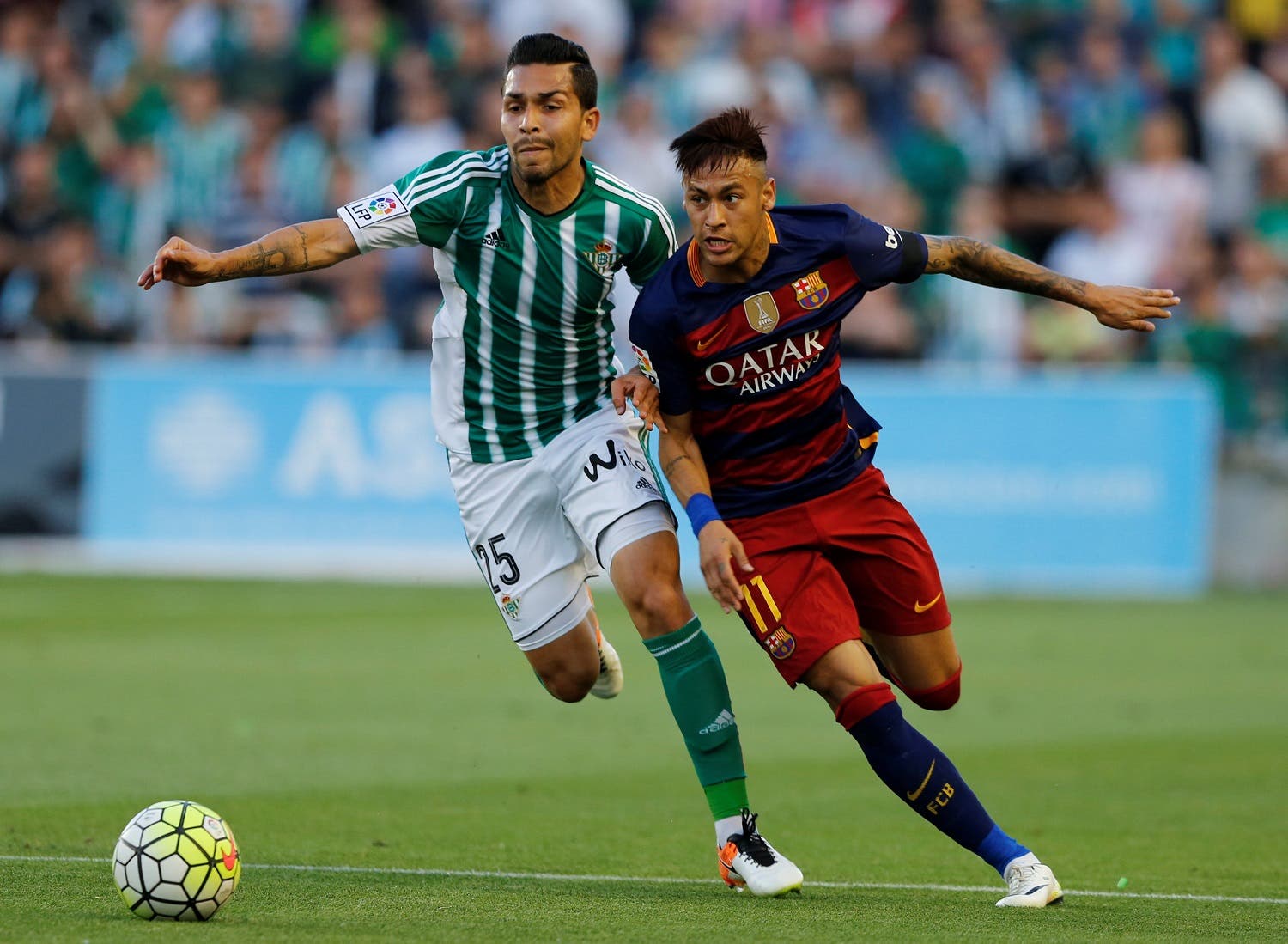 Barcelona's Neymar and Real Betis' Petros Araujo in action. REUTERS