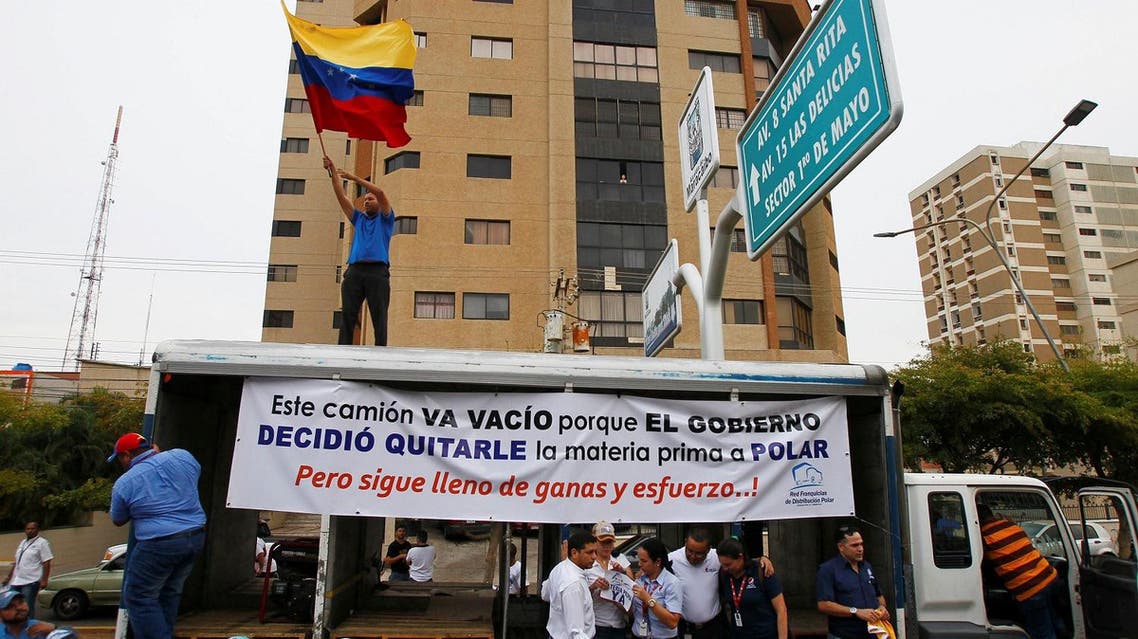 Empresas Polar workers take part in a protest in Maracaibo, in the state of Zulia, Venezuela, April 29, 2016. The placard reads "This truck is empty because the government decided to take the raw material to Polar. But still full of desire and effort!". REUTERS