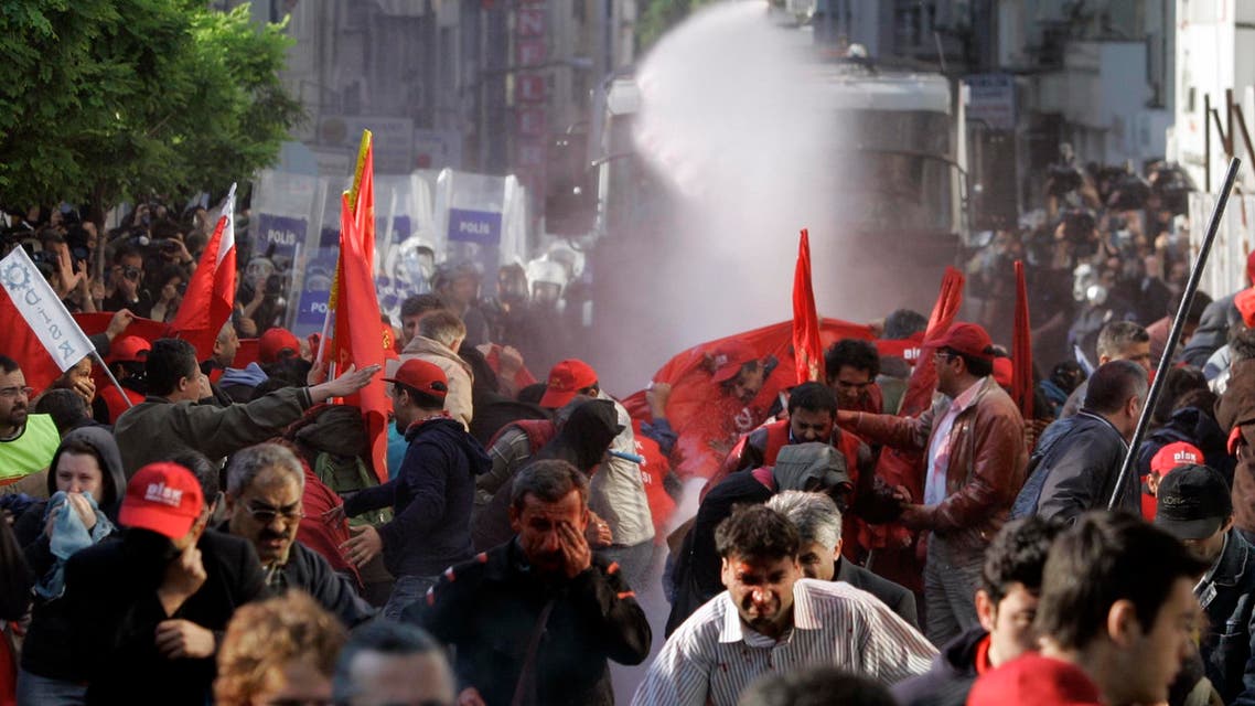 Riot police use water cannon and tear gas to desperse workers during a Labor Day demonstration in Istanbul, Turkey, Thursday, May 1, 2008. (AP)
