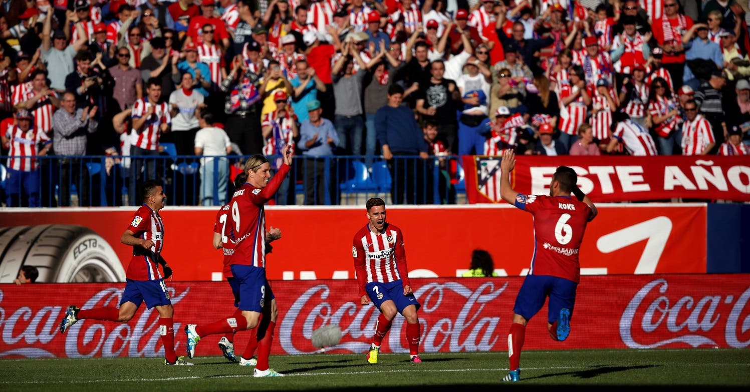 Atletico Madrid's Antoine Griezmann celebrates scoring against Rayo Vallecano with teammates. REUTERS