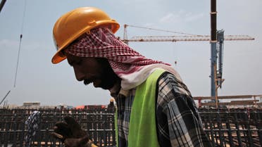  In this May 8, 2014, file photo a man works on construction of the Kingdom Tower, a planned 252-story building, which aims to become the world's tallest skyscraper when complete, in Jiddah, Saudi Arabia. ap