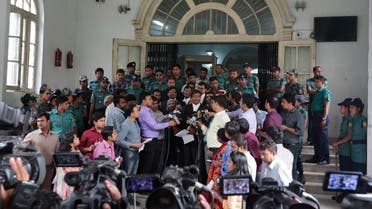 Prosecutor, Sultan Mahmud Simon, center, wearing black coat, talks to the media in front of a special war crimes court after the court sentenced four men to death in Dhaka, Bangladesh, Tuesday, May 3, 2016. (AP)