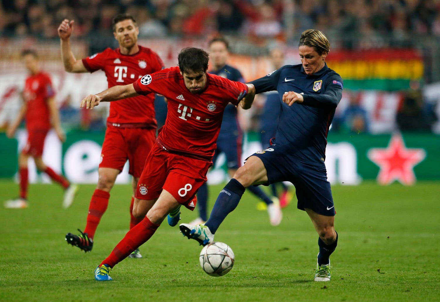 Atletico Madrid's Fernando Torres in action with Bayern Munich's Javi Martinez. (Reuters)