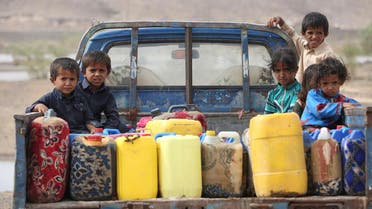 Children ride on the back of a truck loaded with water jerrycans at a camp for internally displaced people in the Dhanah area of the central province of Marib, Yemen, April 30, 2016. REUTERS