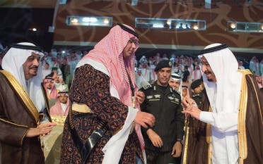 Before the ardha (sword dance) ceremony, Prince Rakan presented a sword to his father. (Photo courtesy: Bandar al-Jaloud)