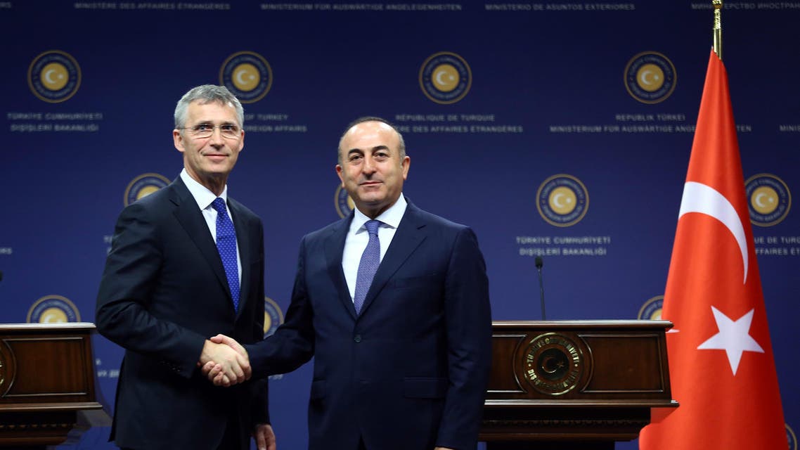NATO secretary general Jens Stoltenberg (L) and Turkish Foreign Minister Mevlut Cavusoglu الأمين العام للناتو ووزير الخارجية التركي