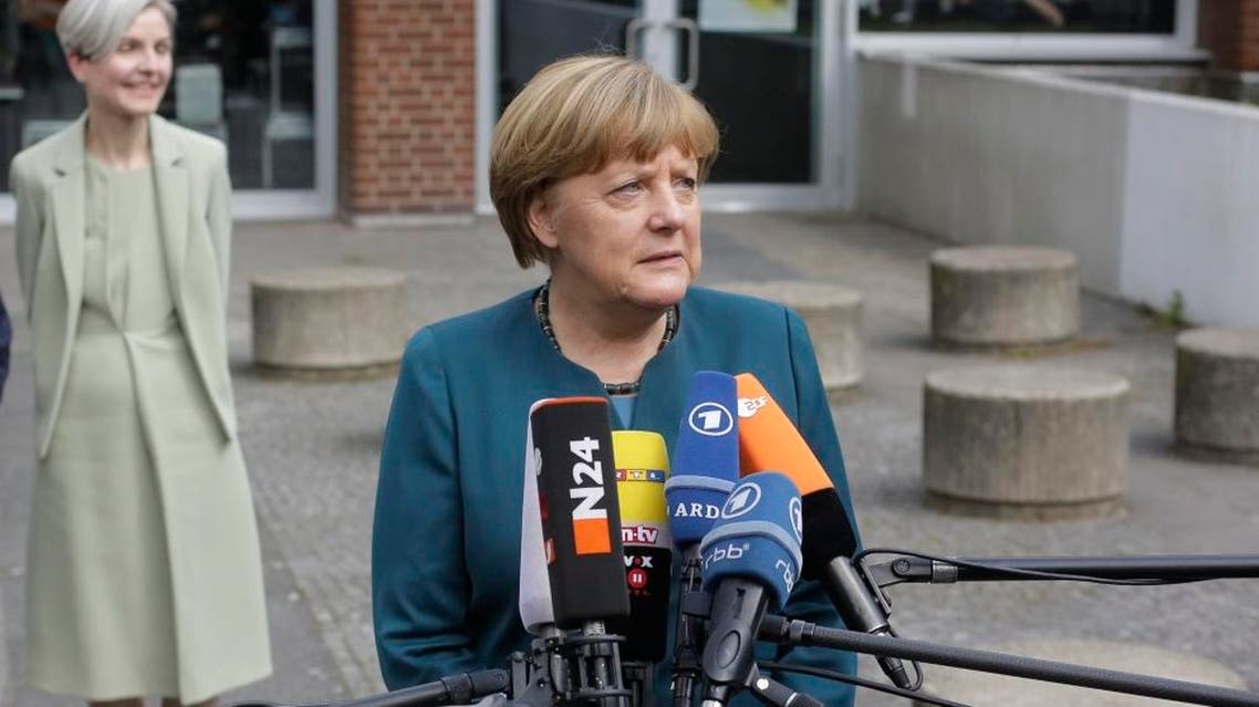 German Chancellor Angela Merkel briefs the media after she visited a European project day at the Lycee Francais school in Berlin, Germany, Tuesday, May 3, 2016. (AP)