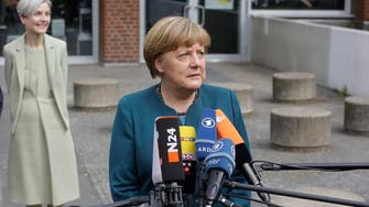 Merkel lends backing to halt rise of France’s far-right