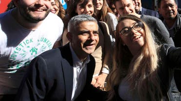 Sadiq Khan, Britain's Labour Party candidate for Mayor of London, poses for a selfie with supporters at Canary Wharf in London, Britain May 4, 2016.  (Reuters)