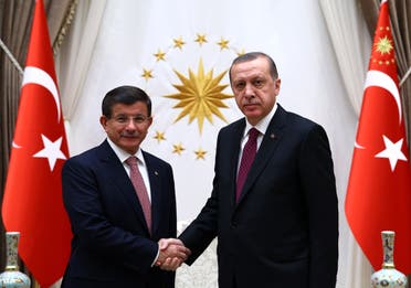 Turkey's Prime Minister Ahmet Davutoglu left, and President Recep Tayyip Erdogan shake hands before a meeting in Ankara, Turkey, Tuesday, Nov. 17, 2015. (AP)