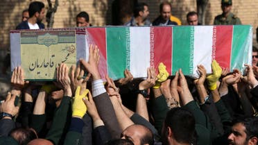  Civilians and armed forces members carry the flag draped coffin of Iranian Revolutionary Guard's Gen. Mohsen Ghajarian, who was killed in fighting in Syria, during his funeral ceremony outside headquarters of the guard's ground forces in Tehran, Iran, Saturday, Feb. 6, 2016. (AP Photo/Vahid Salemi)