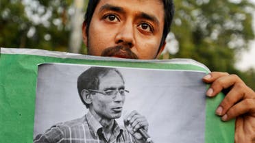  A Bangladeshi student holds a portrait of a University Professor A.F.M. Rezaul Karim Siddique during a protest against the killing in Dhaka, Bangladesh, Friday, April 29, 2016. Professor Siddique was hacked to death on his way to work at the state-run university in the Bangladeshi city of Rajshahi on April 23, 2016, where he taught English. The Islamic State group claims responsibility, but the government dismissed the claim and instead blames local religious radicals. (AP Photo)