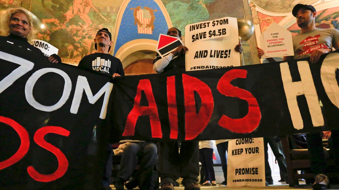 AIDS activists rally in the War Room at the Capitol on Monday, March 28, 2016, in Albany, N.Y. Several dozen people rallied to push for $70 million in funding as New York Gov. Andrew Cuomo and legislators negotiate the state budget before a Friday deadline. According to the Cuomo administration, the proposed budget includes $2.5 billion for programs related to AIDS, including $10 million in new money. (AP Photo/Mike Groll)