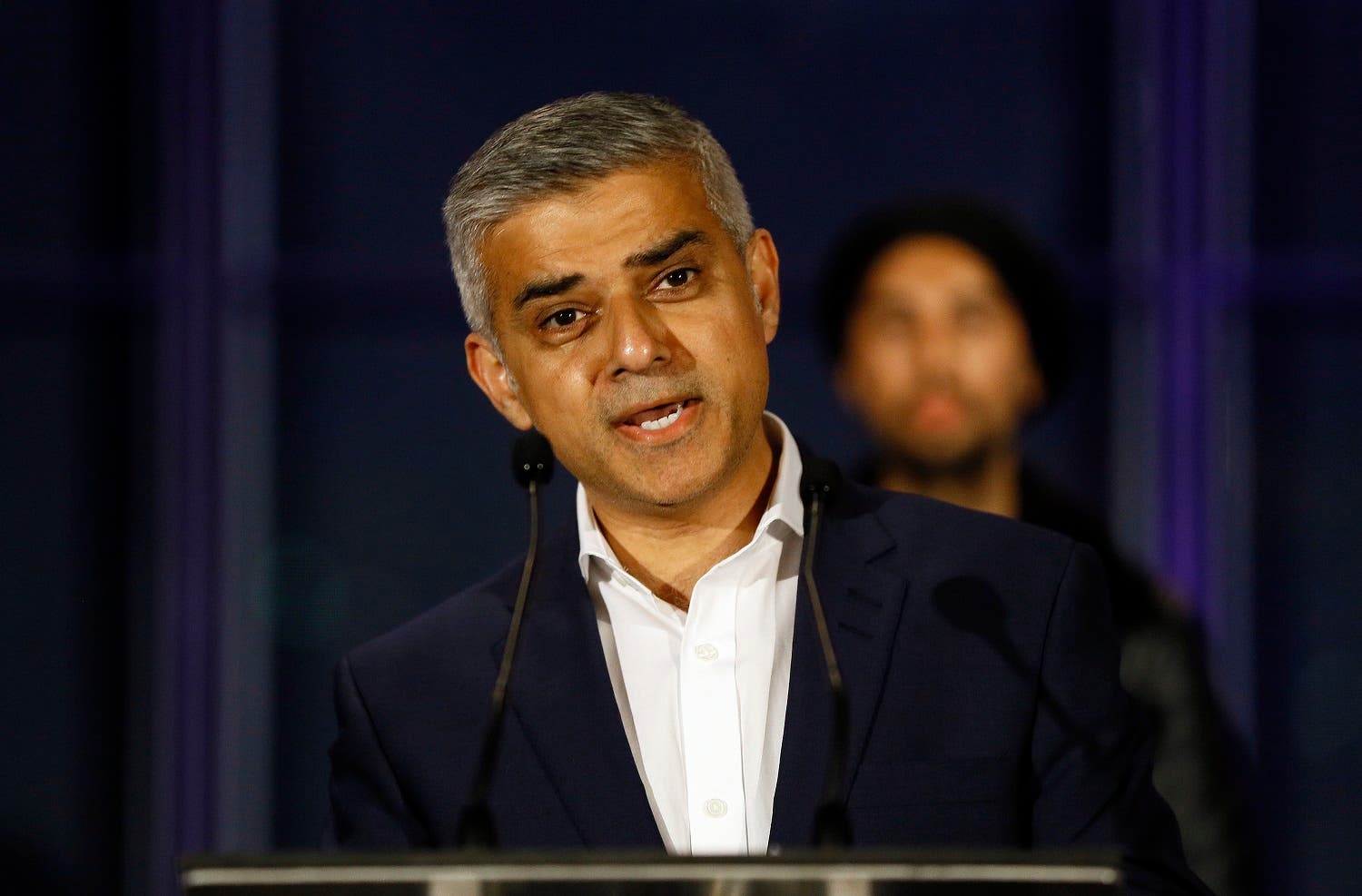 Sadiq Khan speaks on the podium after hearing the results of the London mayoral elections, at City Hall in London, Saturday, May 7, 2016. (AP Photo/Kirsty Wigglesworth)